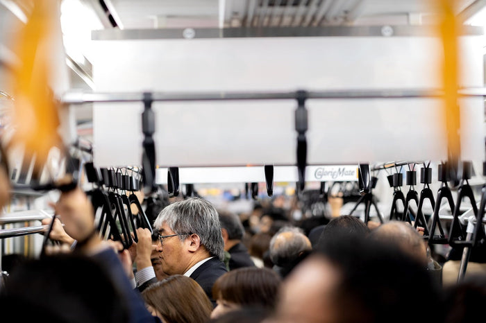 A crowded subway scene depicting commuters and their everyday commute kit in an Electronics & Accessories Store.