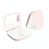 Portable LED Makeup Mirror with magnification, compact and travel-friendly design in pink.