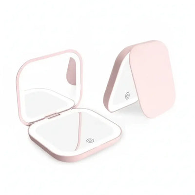 Portable LED Makeup Mirror with magnification, compact and travel-friendly design in pink.