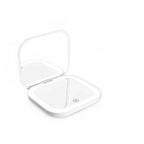  Portable LED Makeup Mirror with magnification, compact and travel-friendly design in pink.